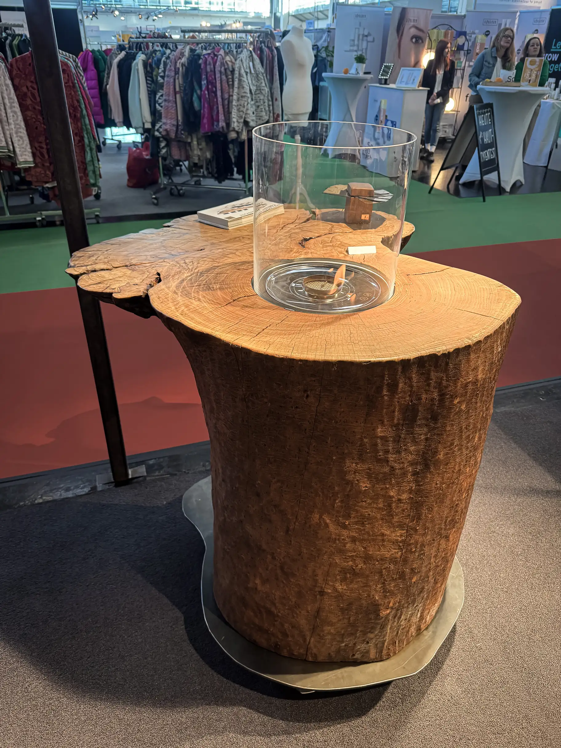 Designer standing table made from an ash tree trunk with live edge and central fire section
