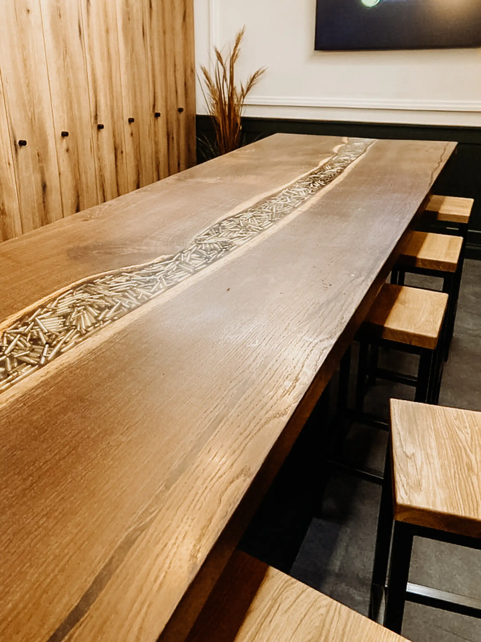Sales table with epoxy resin and cartridges, wooden furniture for retail store