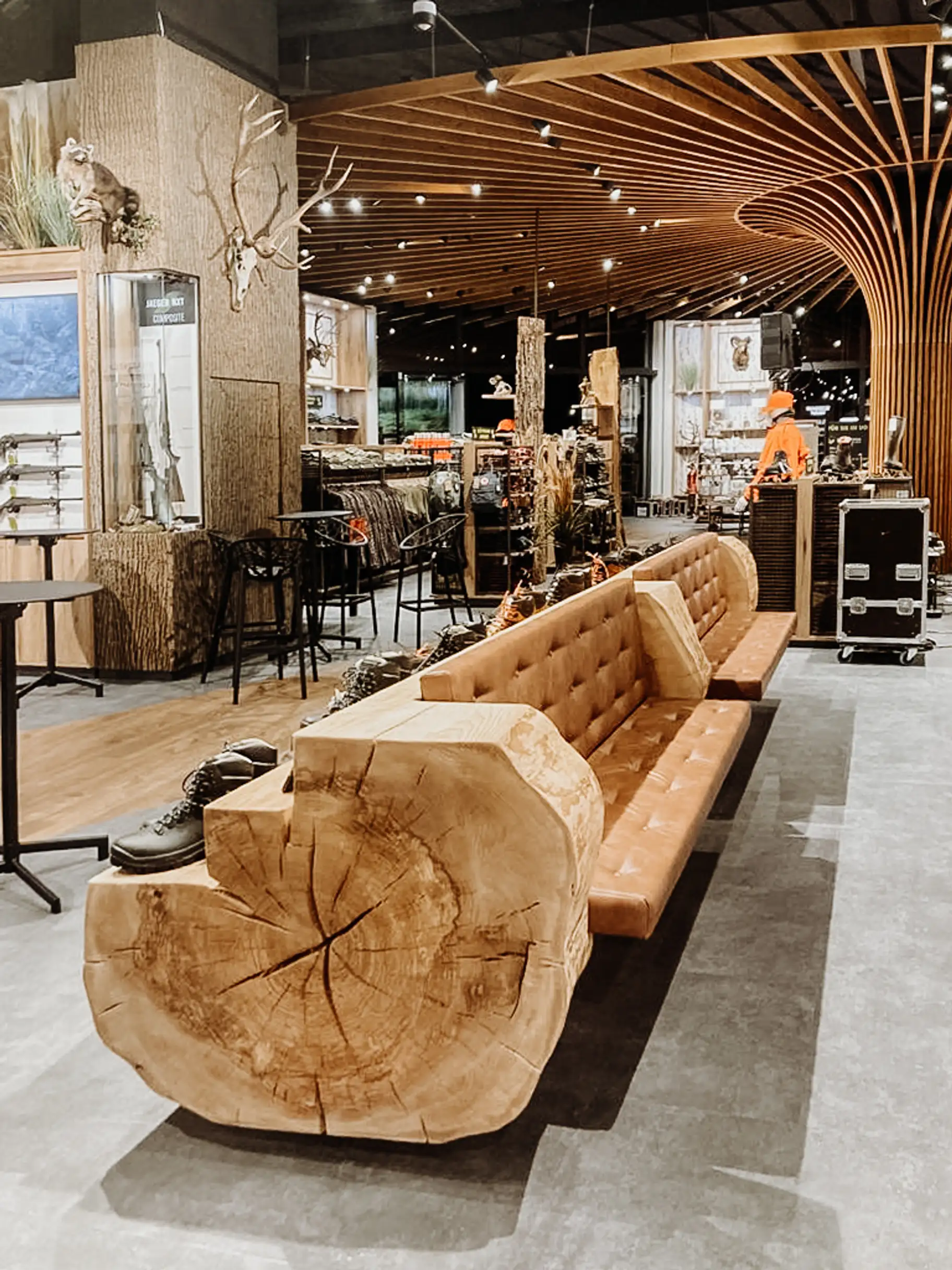 Bench and display stand made from a solid ash tree trunk, wooden furniture for retail store