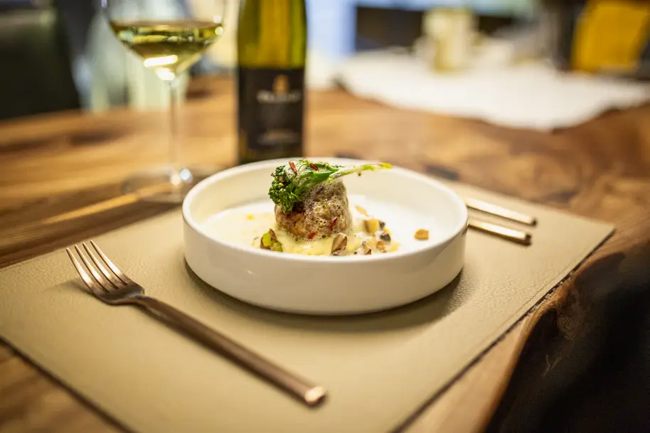 Gourmet food elegantly plated on a plate at Stammdesign