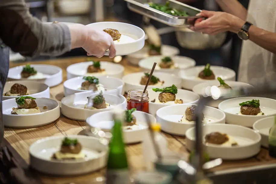 Food artistically plated on several plates