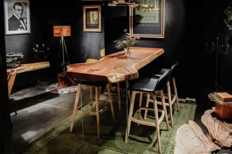 Heavy-duty standing table for hospitality with sturdy glass legs and durable surface by Stammdesign.