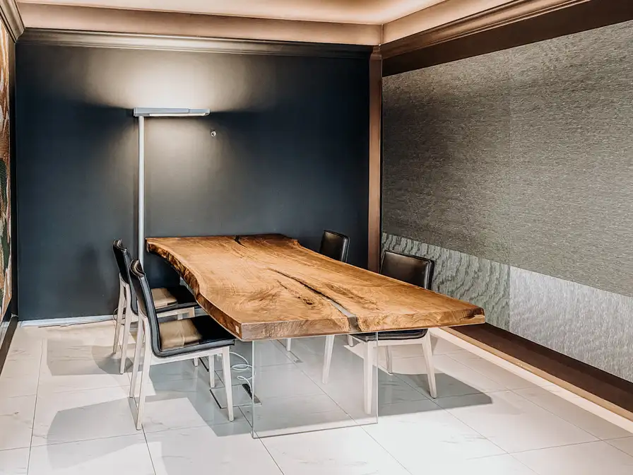 Modern office desk with natural live edge from a walnut tree trunk by Stammdesign.