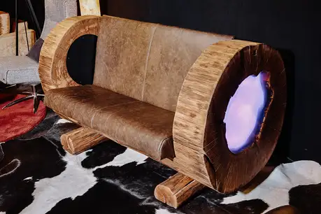 Unique wooden couch made from a tree trunk by Stammdesign for living rooms and gastronomy.