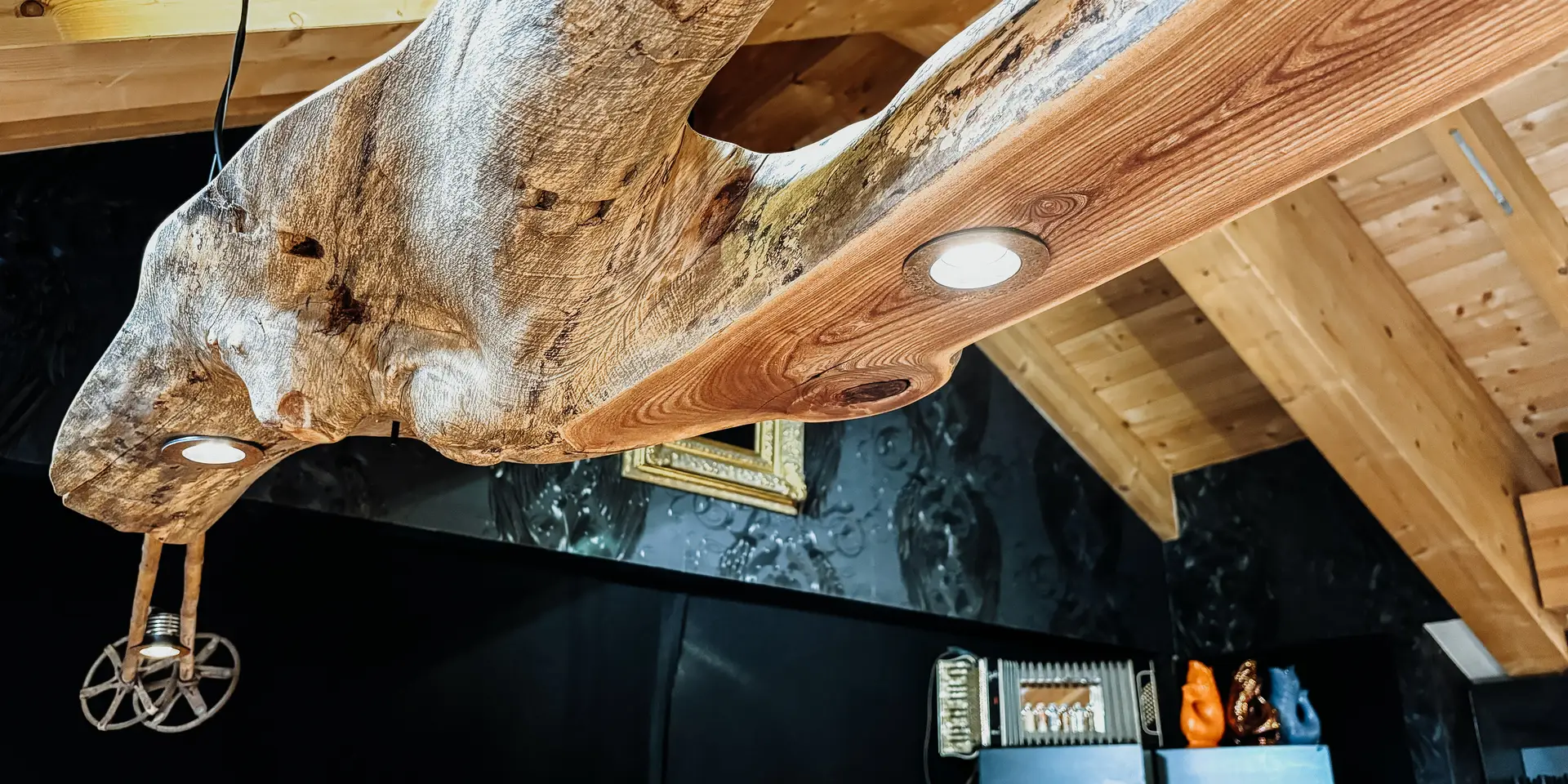 Creative hanging lamp with ceiling mount made of wood by Stammdesign.