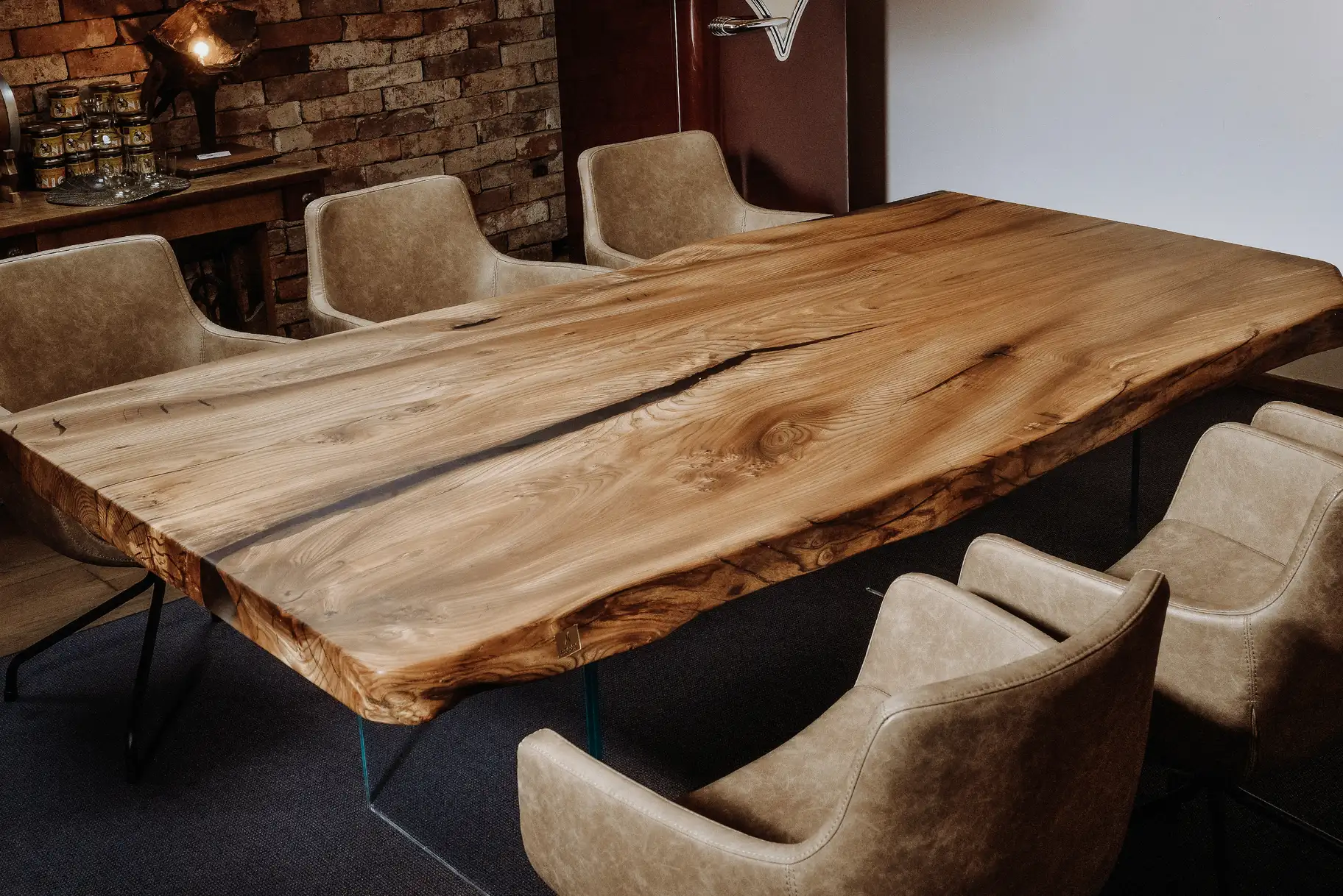 Designer living room table from a tree trunk with a noble live edge, handcrafted from elm, side view.