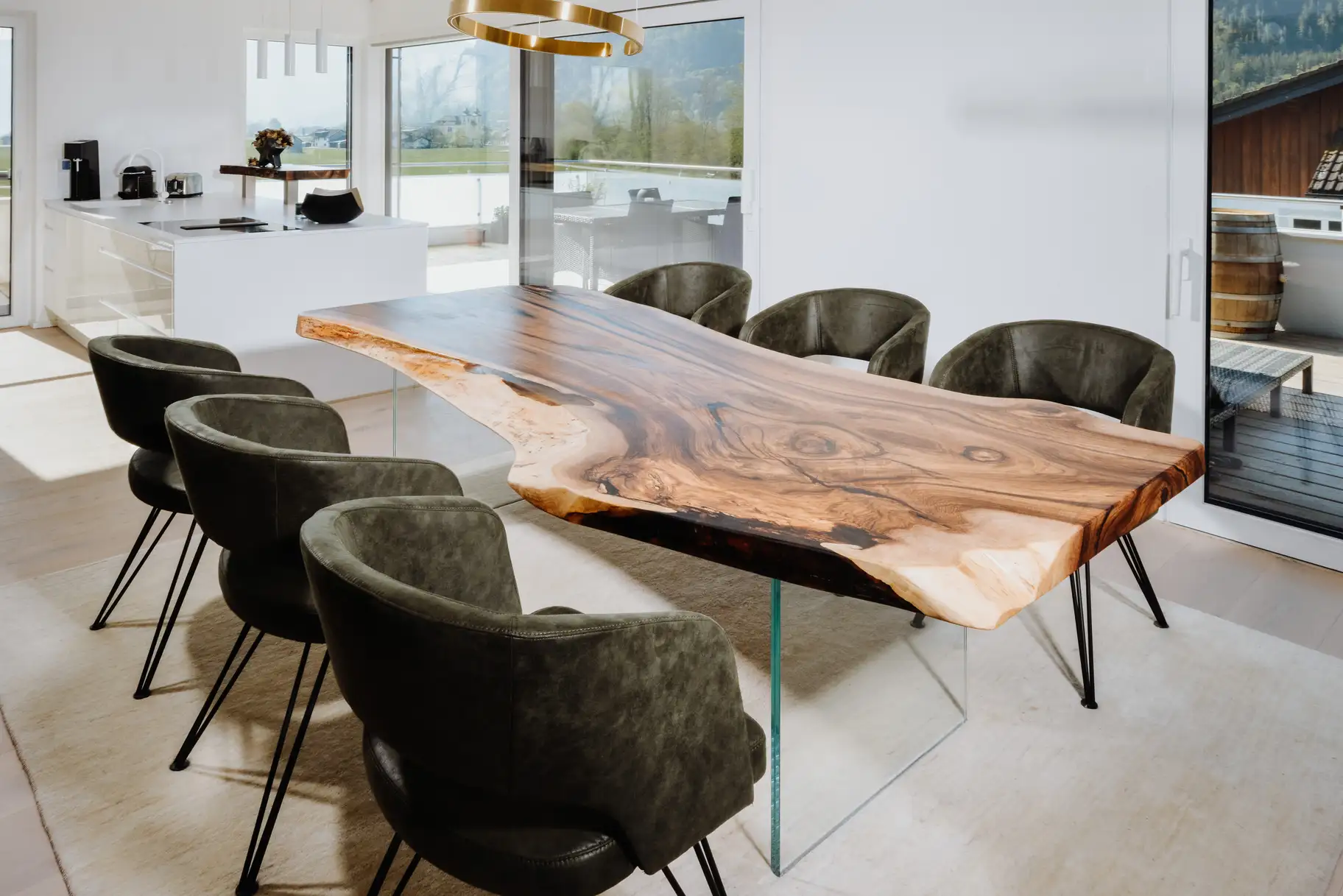 Designer dining table made from a tree trunk with elegant live edge, handcrafted from walnut, right view