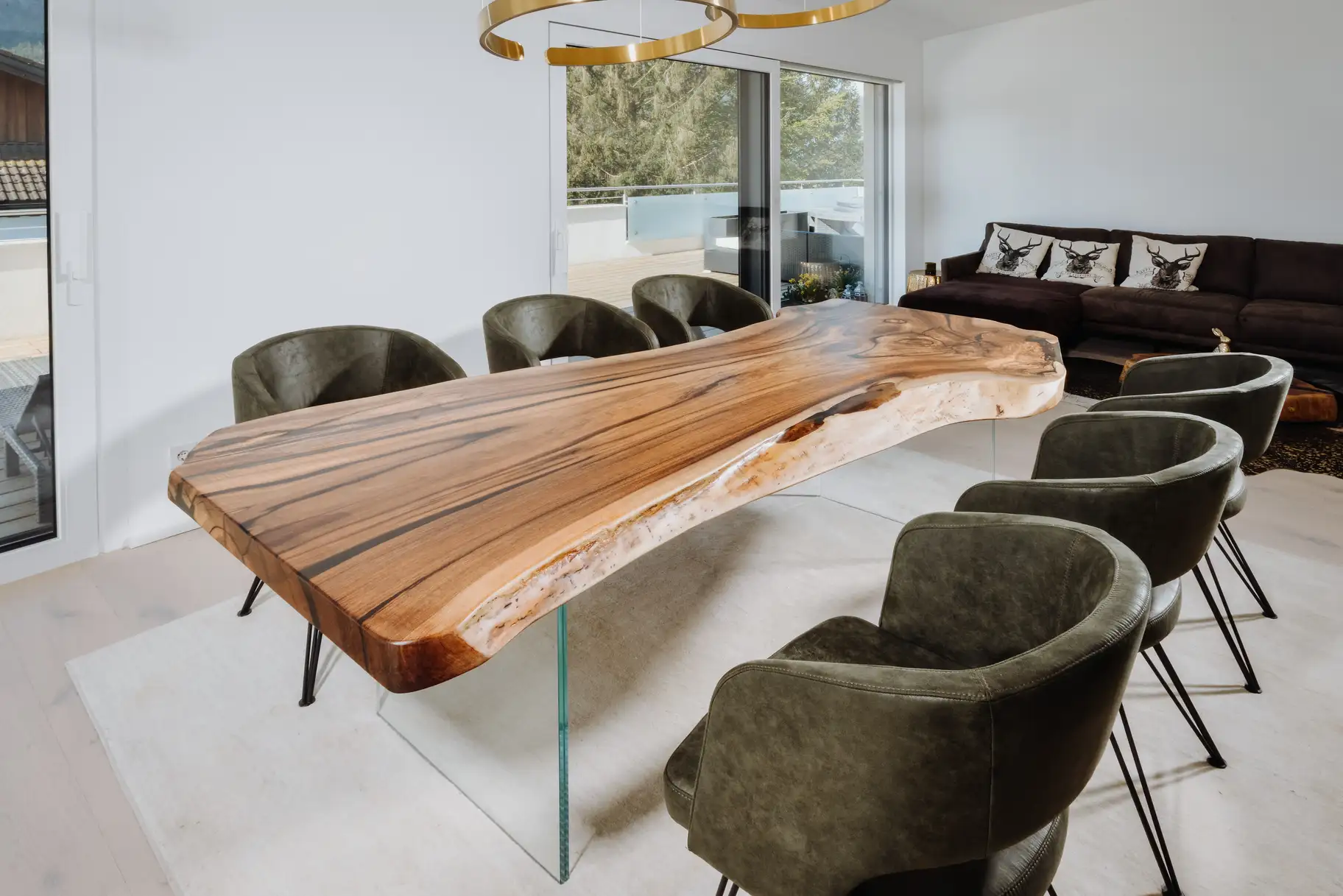 Designer dining table made from a tree trunk with elegant live edge, handcrafted from walnut, left view
