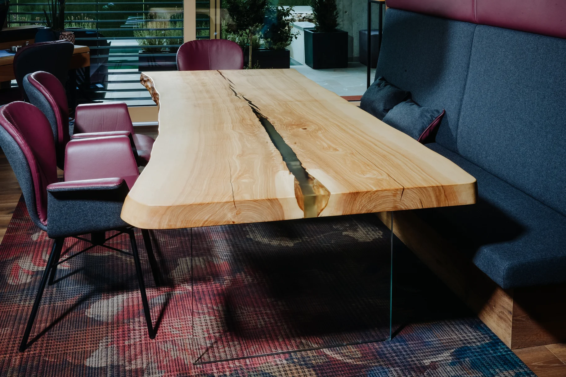 Designer dining table made from a tree trunk with elegant tabletop, perfect for any ambiance, view 3