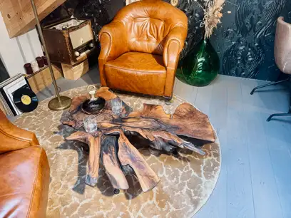 Coffee and side table made from a walnut tree root with natural live edge and unique shape