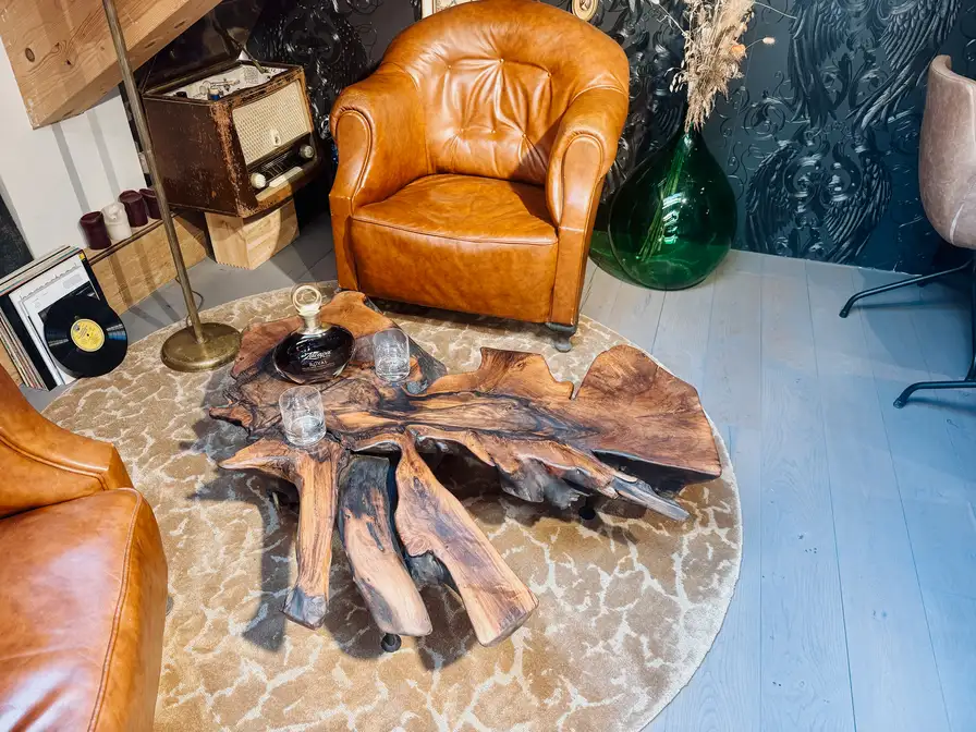 Coffee and side table made from a walnut tree root with natural live edge and unique shape